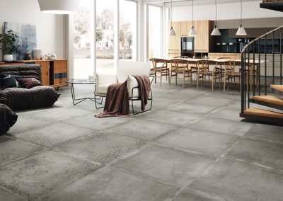 square grey matte stone tiles concrete tiles used on living area open plan floor from from design di lusso watford tile shop